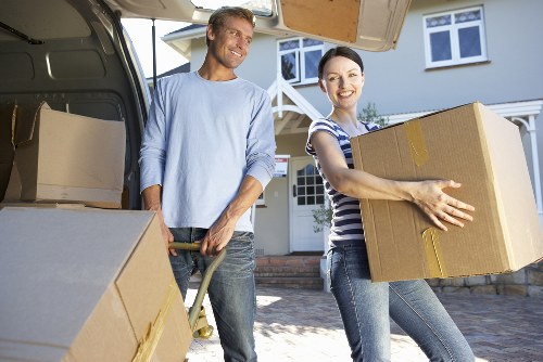 Professional movers handling furniture in a Sydenham Hill property